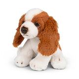 Stuffed dog toy with brown and white fur on a white background