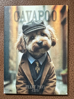 Magnet of a dog wearing a cap and suit with 'Cavapoo' and 'Peaky Paws Club' text on background.