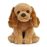 Plush toy cocker spaniel dog with floppy ears on a white background