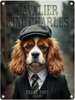Cavalier King Charles dog in a suit with 'Peaky Paws Club' text on a metal sign.